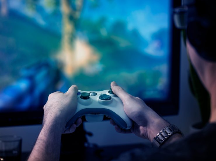 Illustrazione di un videogiocatore (Canva FOTO) - vehiclecue.it
