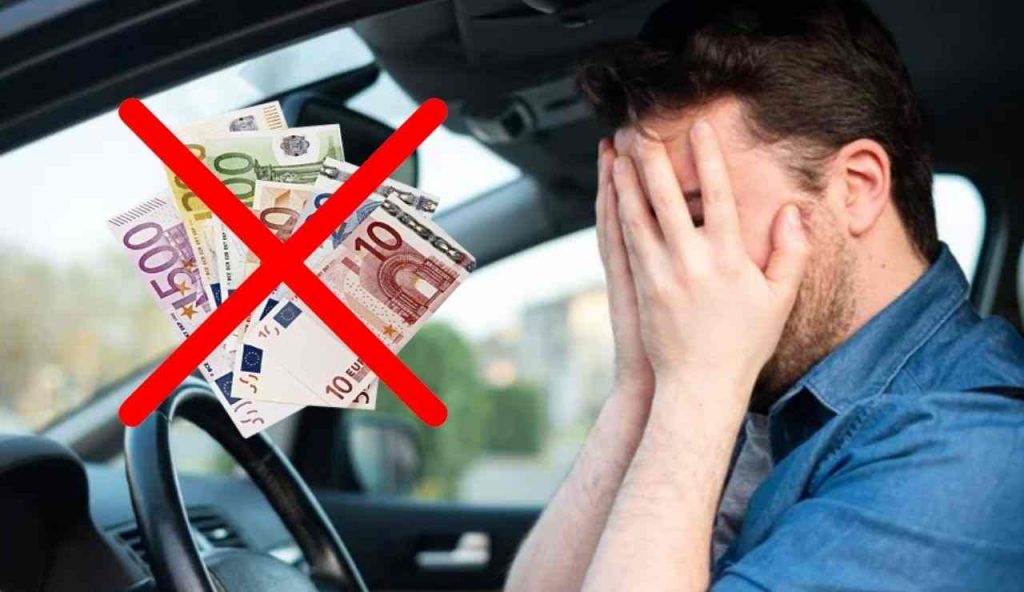 Uomo disperato in auto (Depositphotos foto) - www.vehiclecue.it